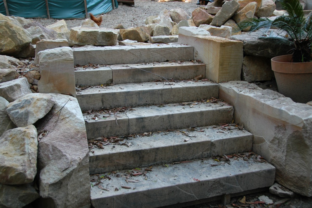 Convert excavation waste to useful landscaping material Reuse the cut stone for landscaping